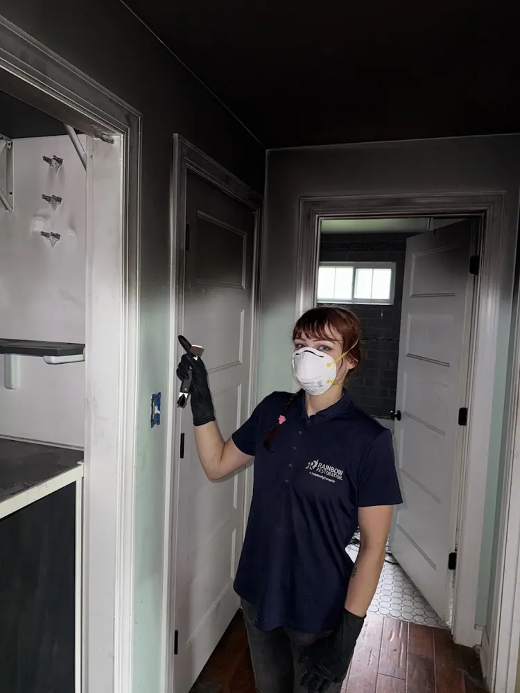 Peninsula Water & Flood Restoration technician in protective gear on a job in San Mateo